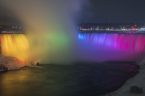 Niagara Falls Nighttime lit with Rainbow